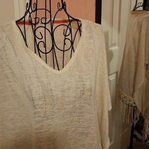 Cream poncho top with fringe